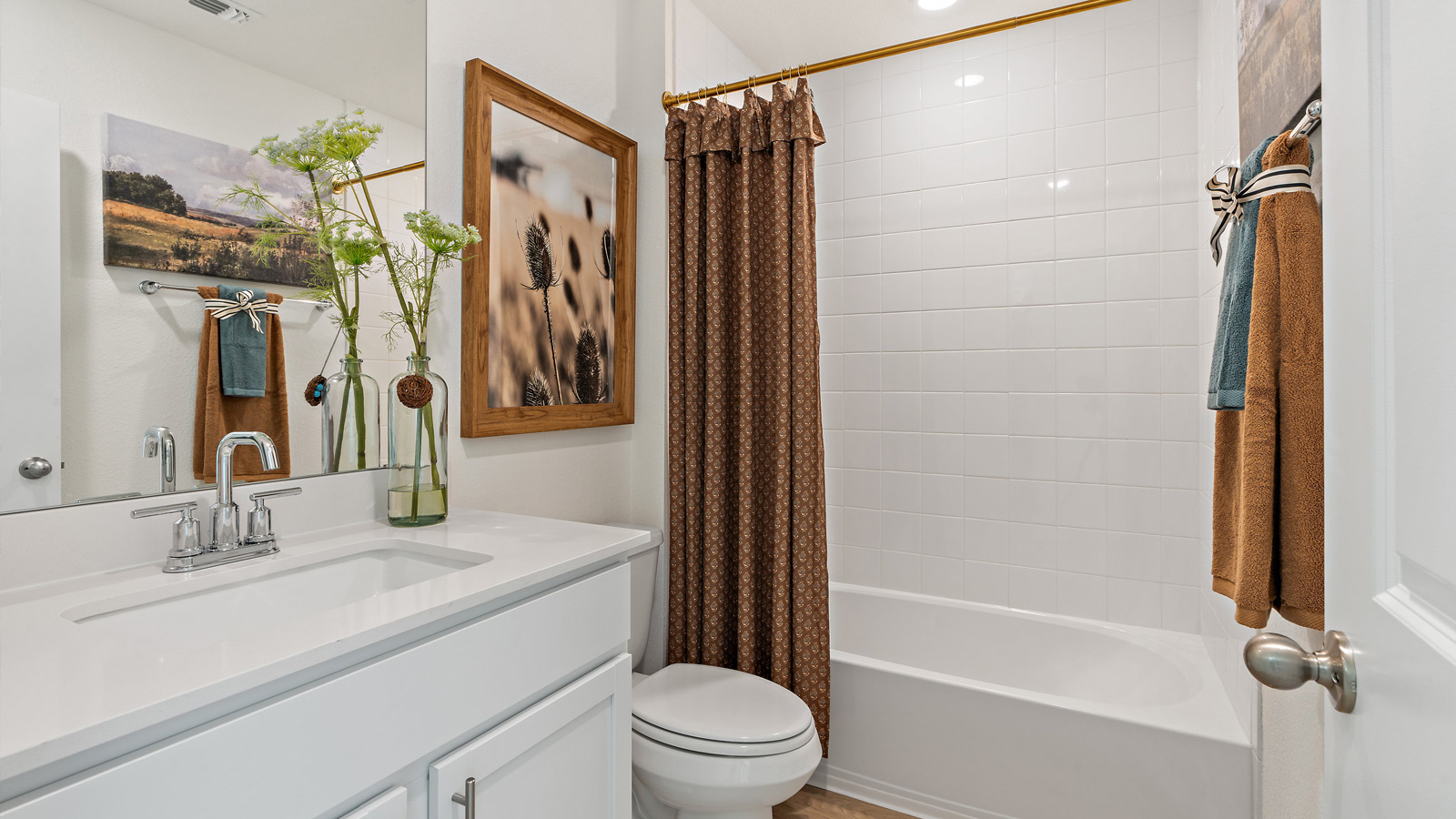 Bathroom 2 with bathtub and single vanity sink.