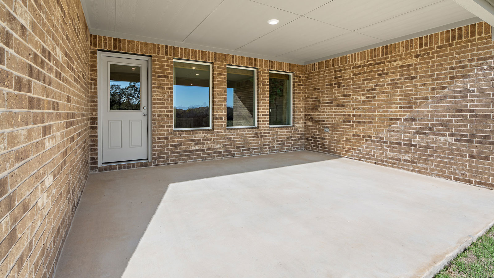 Backyard with large back patio.