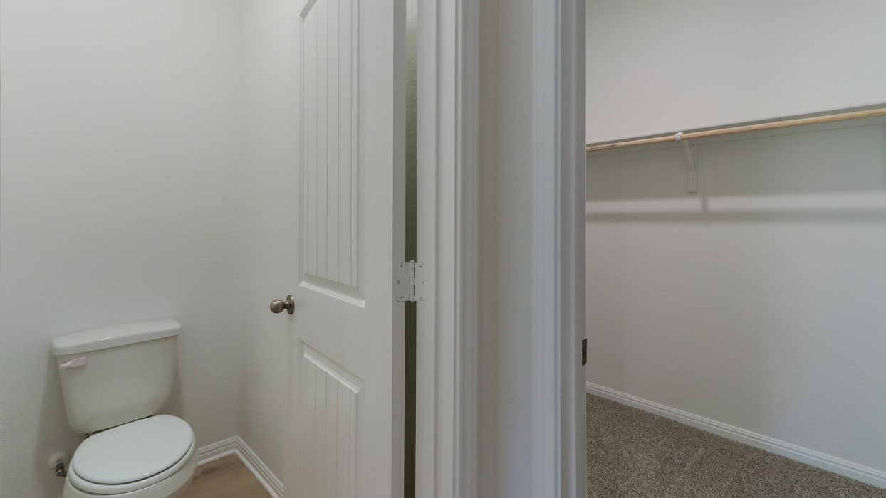 Bathroom with a separate door for the toilet.
