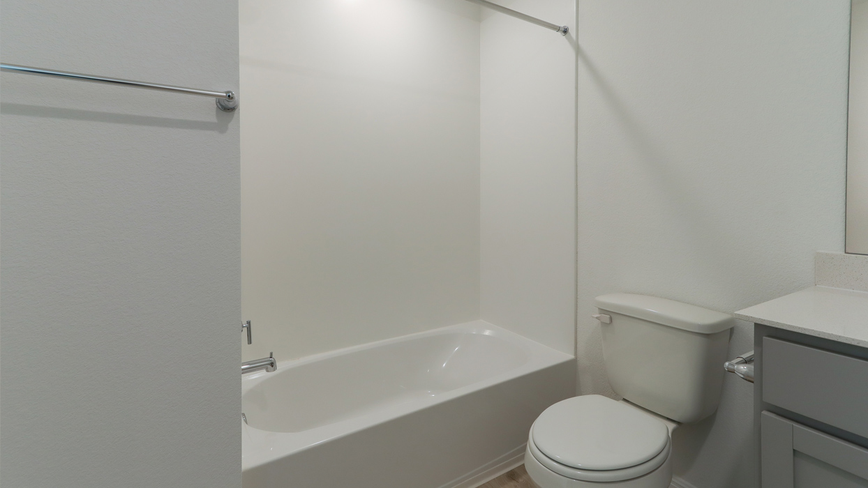 Bathroom with a step in shower.