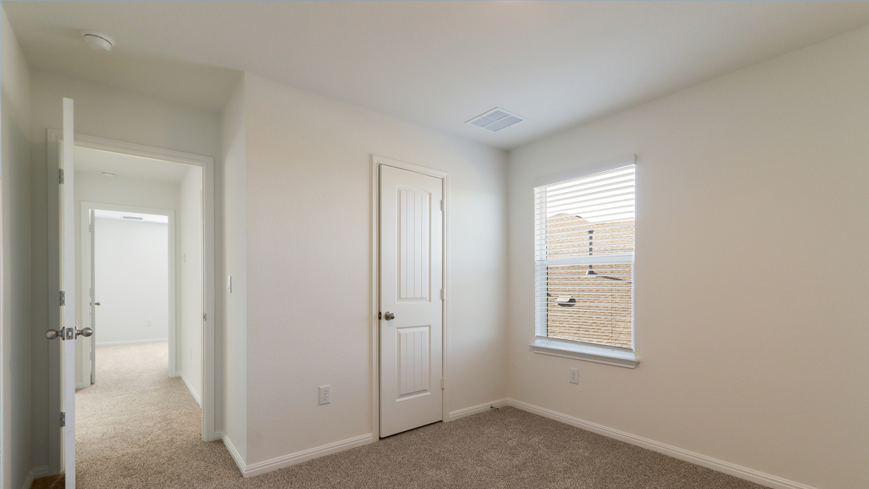 Bedroom with a closet and single window.