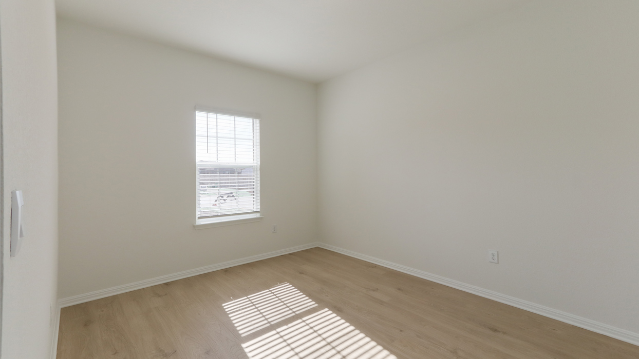 Optional study room with a single window and tile flooring.
