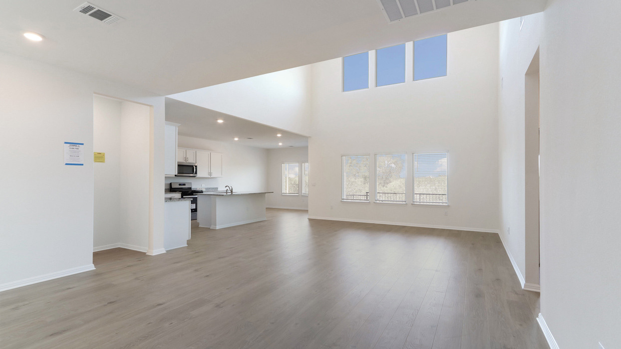 Living room with high ceilings and open space.