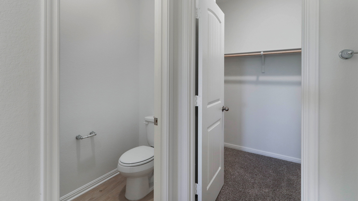 Primary bathroom with a separate door for toilet.