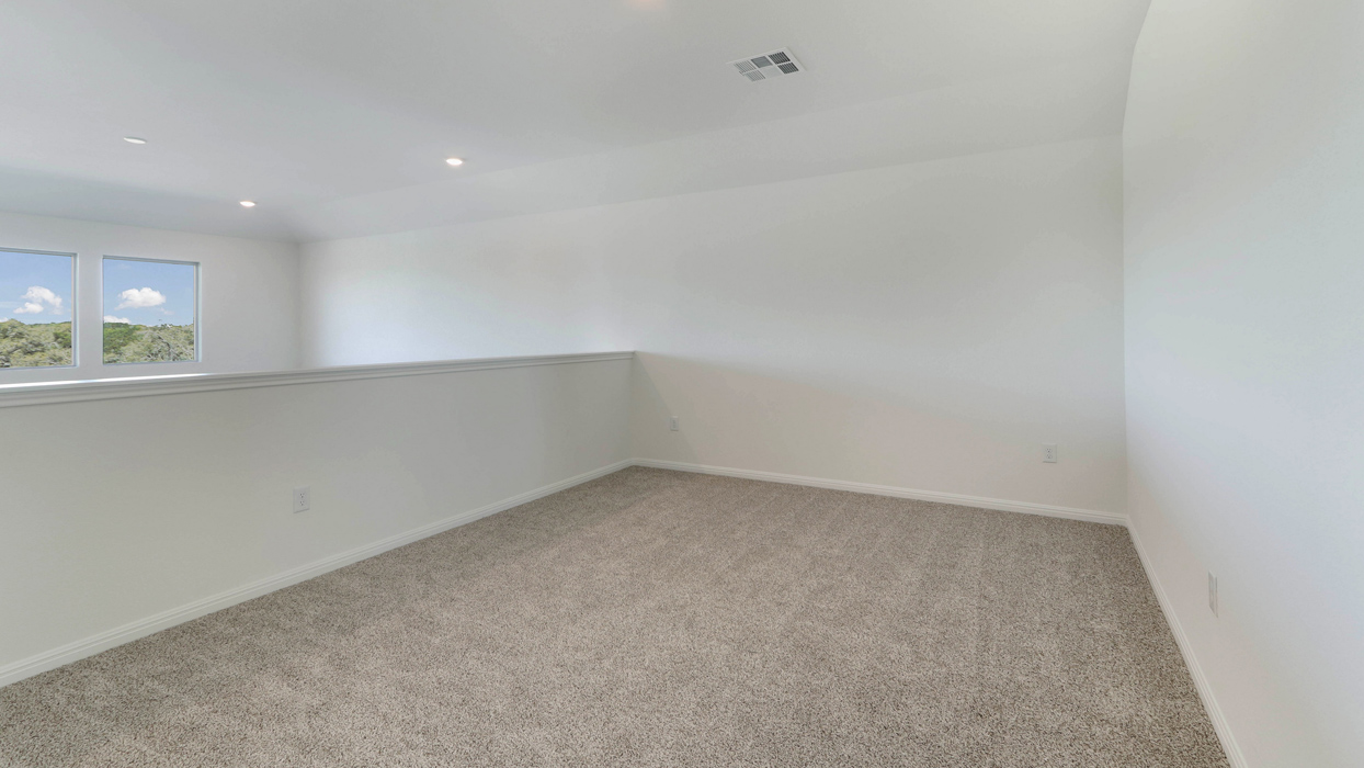 Carpeted upstairs loft area.