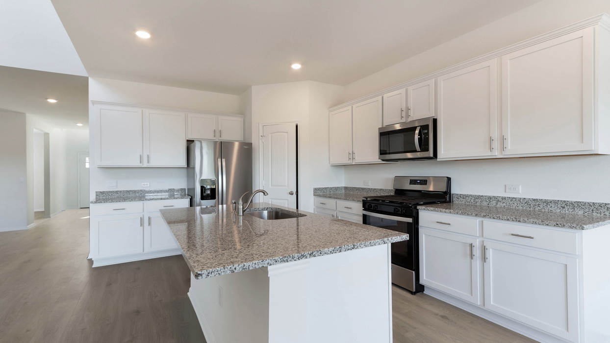 Kitchen with stainless steel appliances.