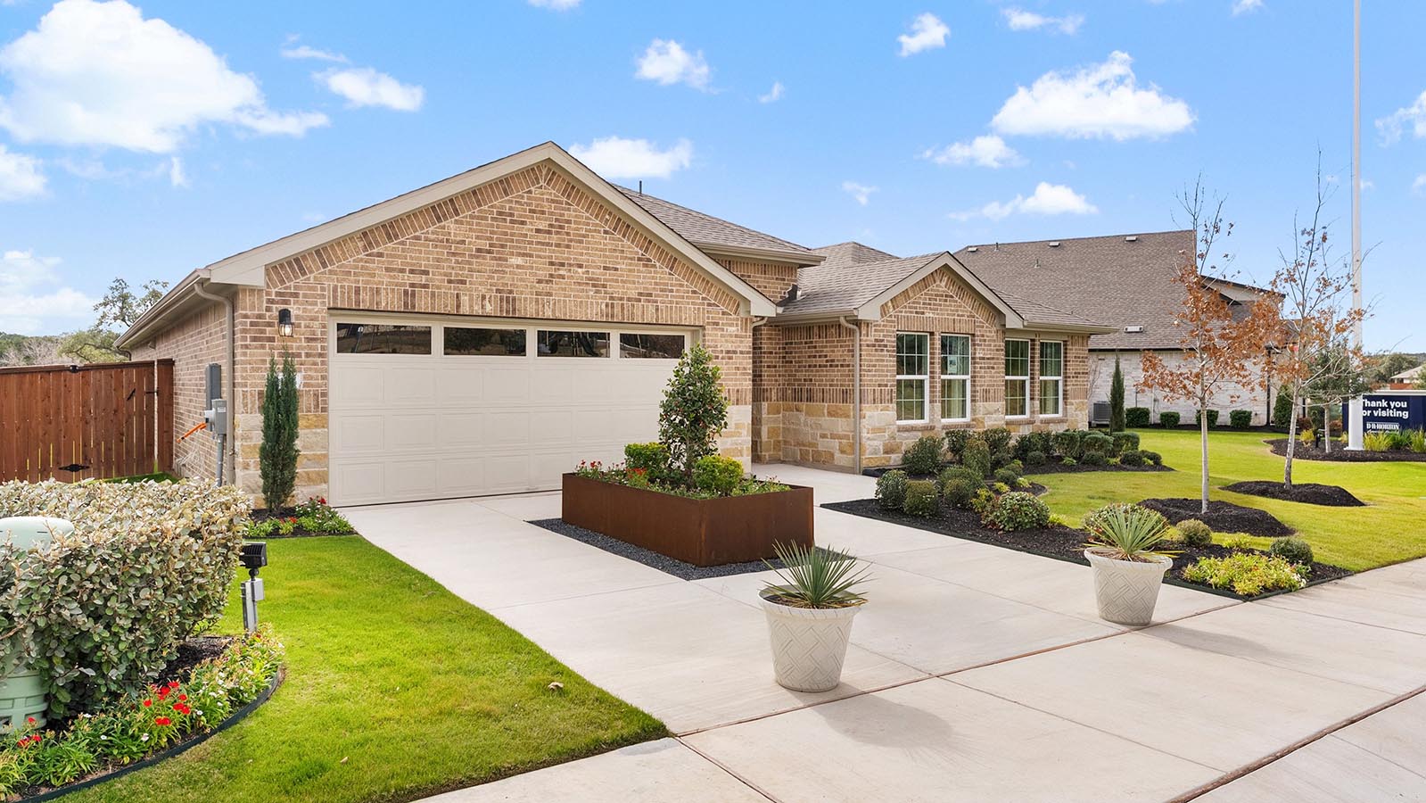 riverview model home single story with brick exterior and shingle roof