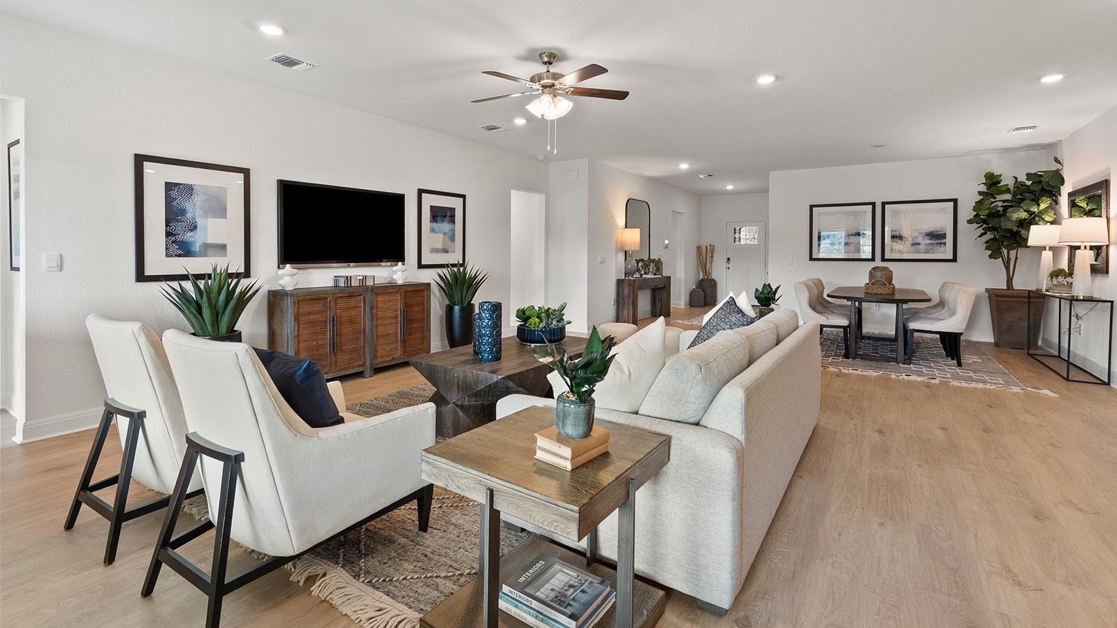 Living room with 3 large windows just off of the kitchen