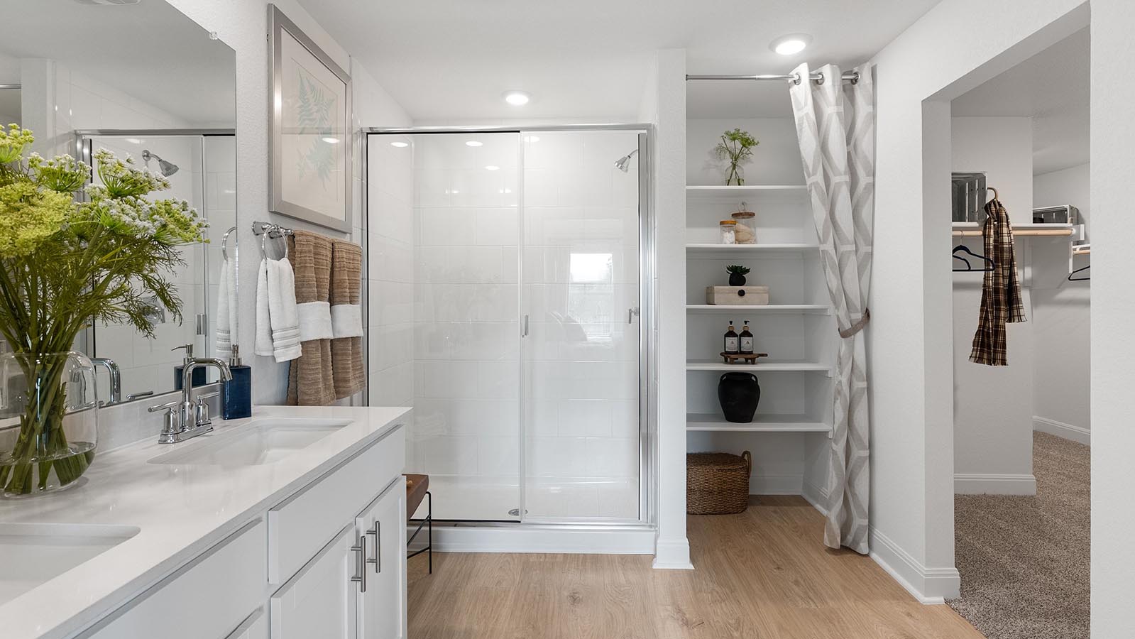 Primary bathroom with standing shower and dual sink