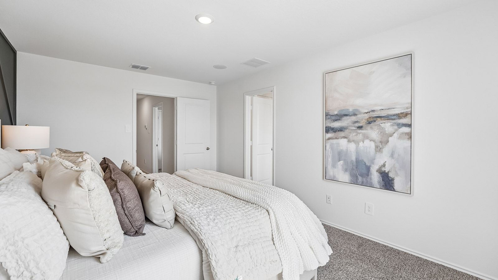 Bedroom 1 with window and carpeted flooring.