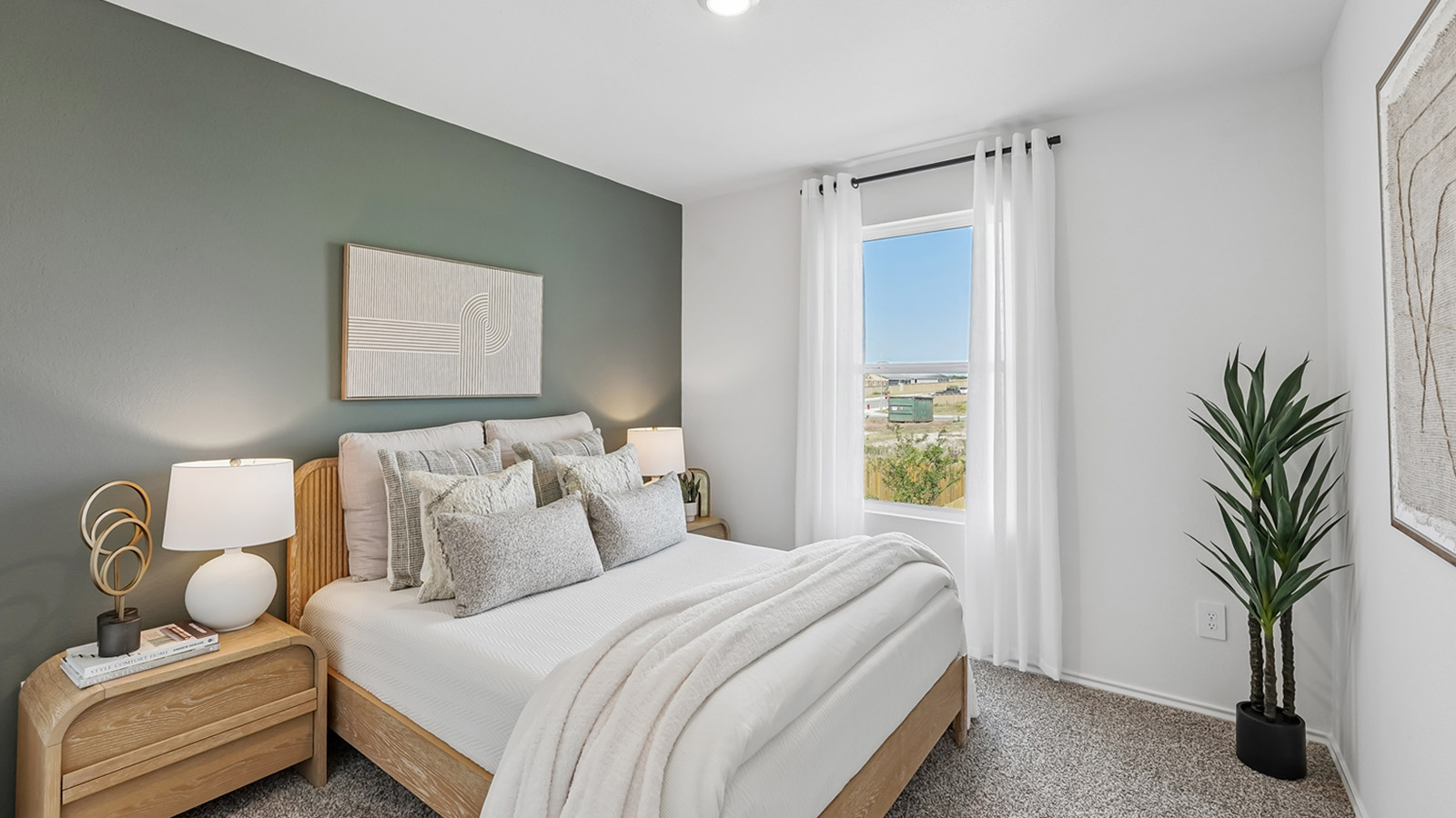 Bedroom 3 with window and carpeted flooring.