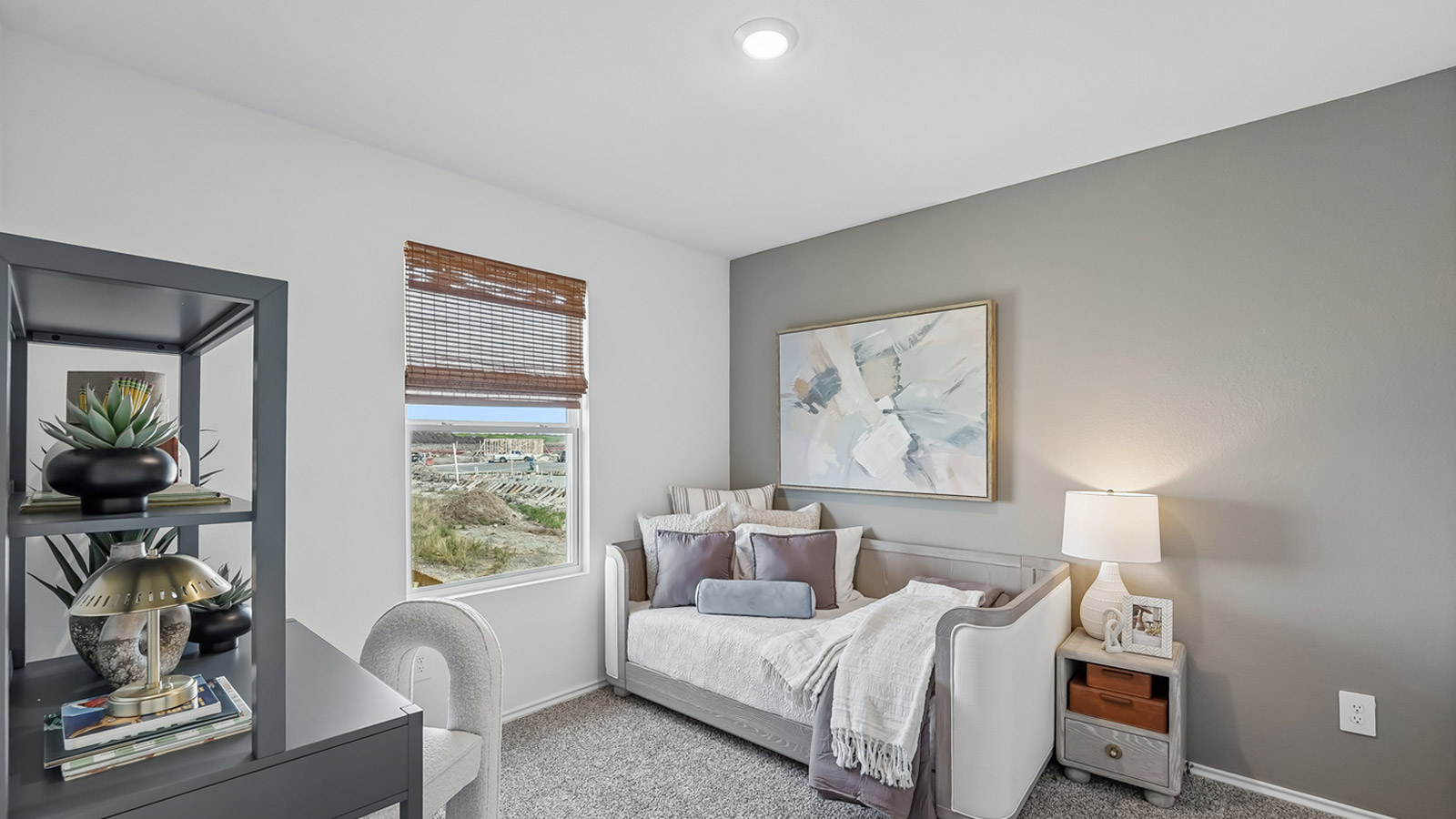 Bedroom 5 with window and carpeted flooring.