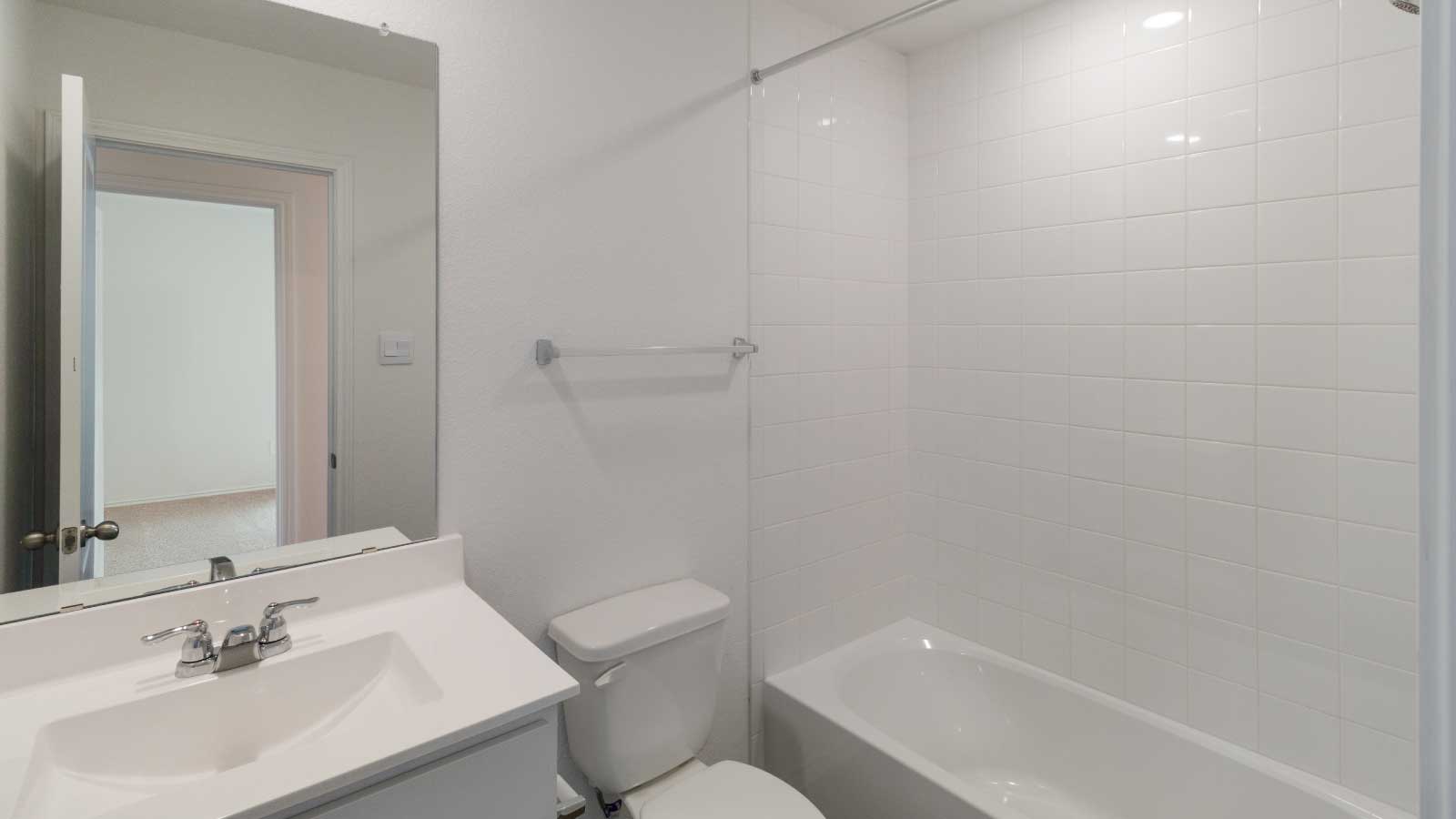 Bathroom with a sink, toilet, and a shower tub.