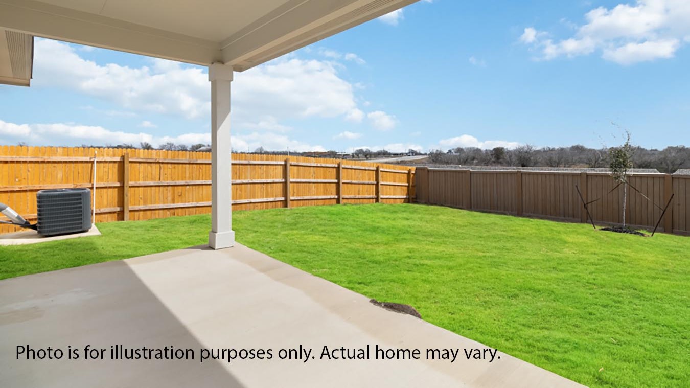back yard with covered patio and sod