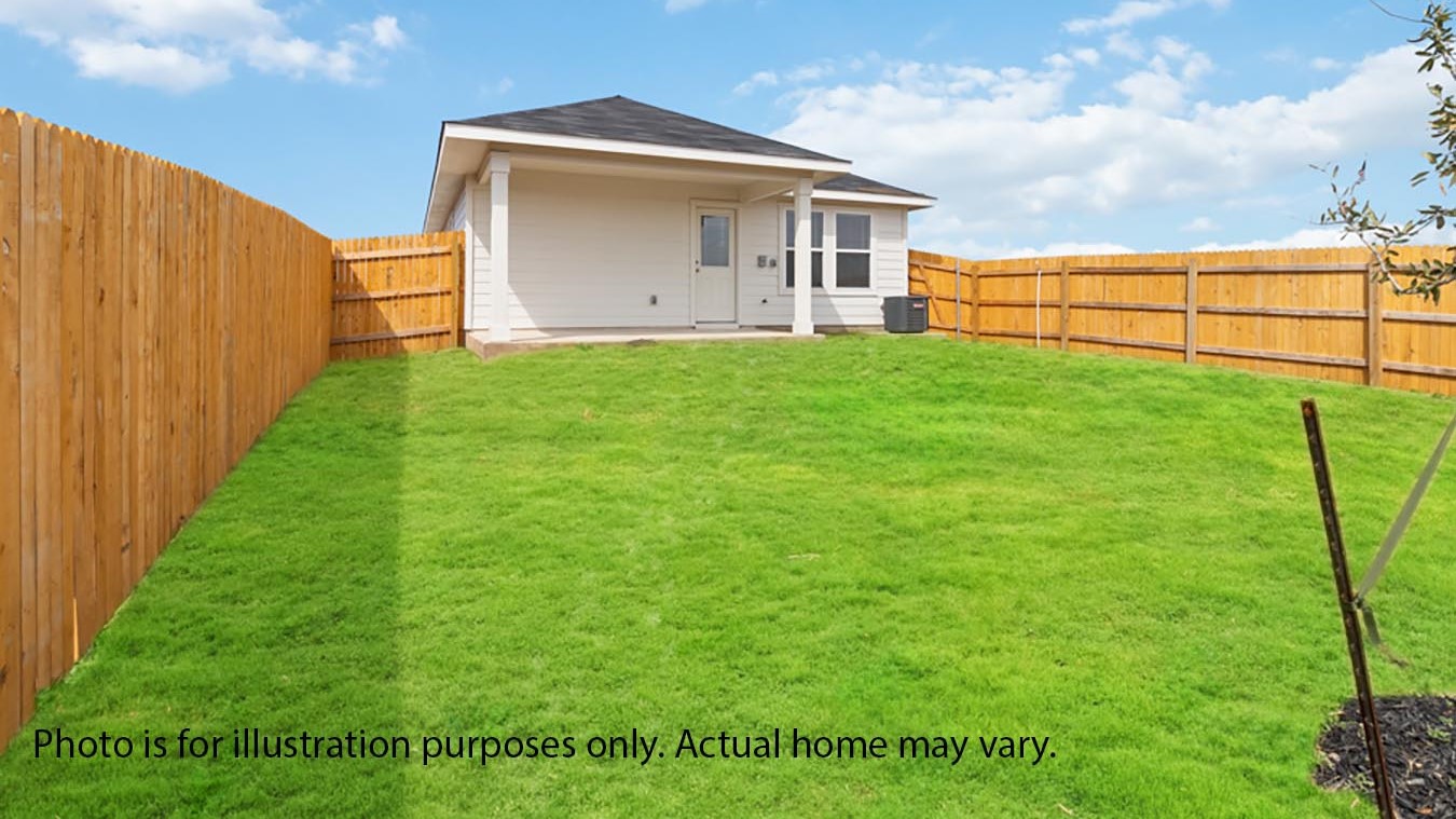back yard with covered patio and sod