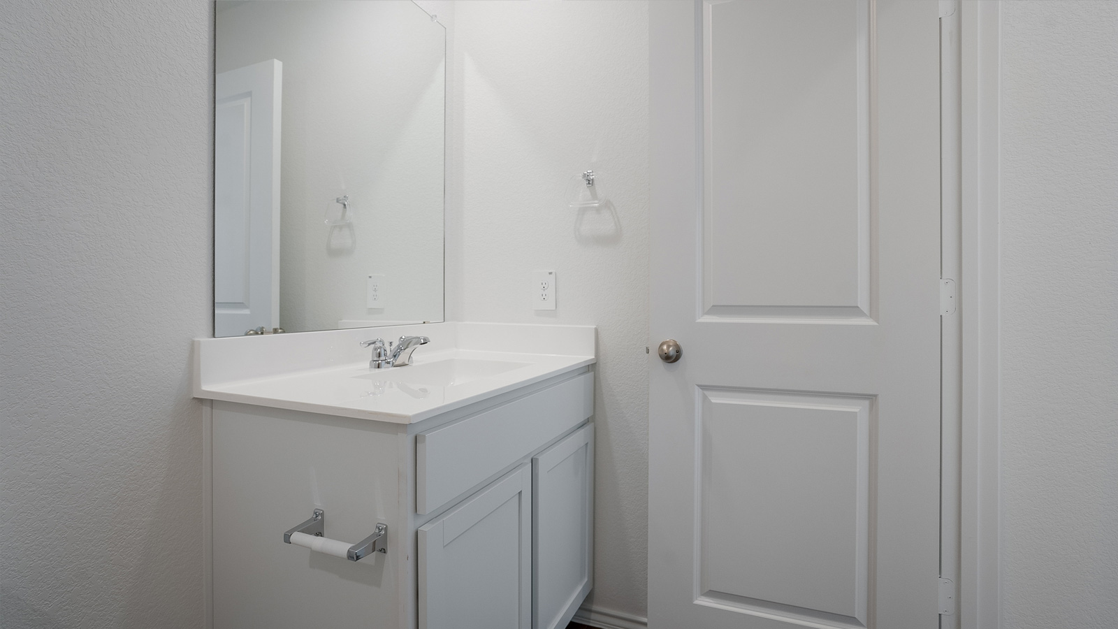 Bathroom 2 with single vanity sink and quartz countertops.