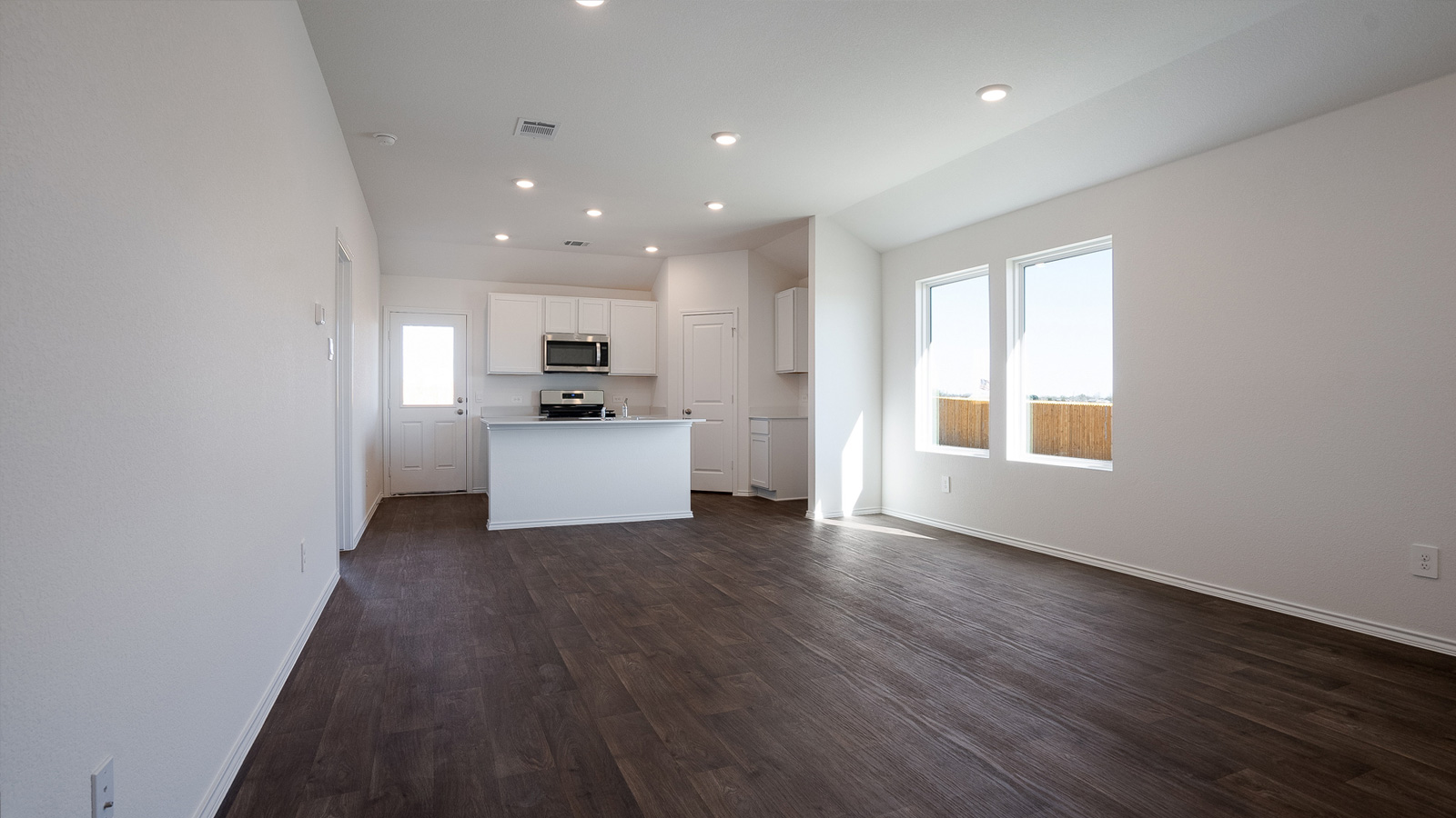 Open concept kitchen with large kitchen island.