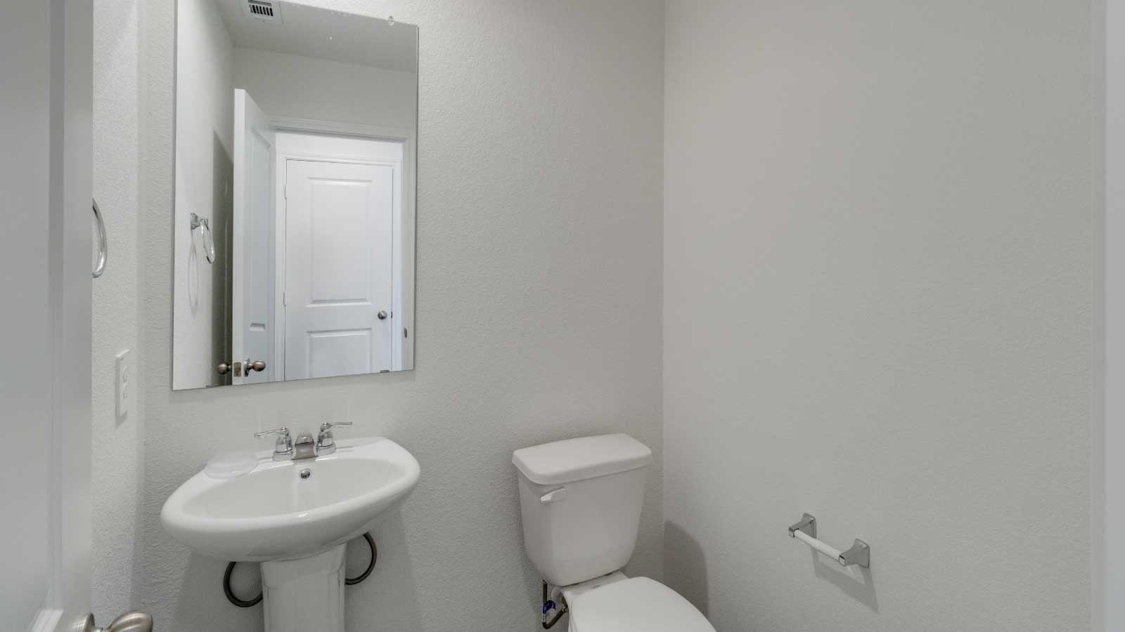 Bathroom with a sink and a toilet.