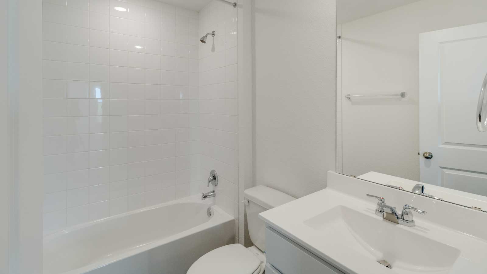 Bathroom with a sink, toilet, and a shower tub.