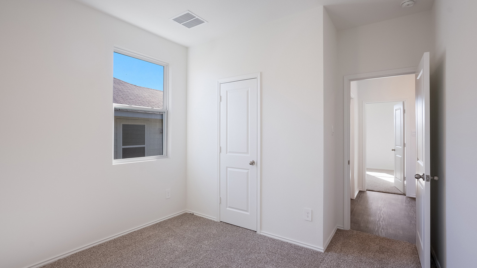 Bedroom 2 with carpeted floors.