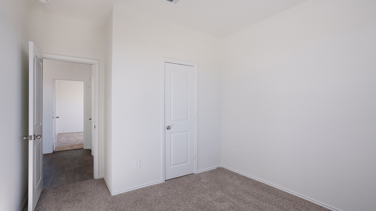 Bedroom 3 with carpeted floors.