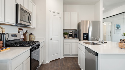 Gorgeous kitchen with stainless steel appliances.