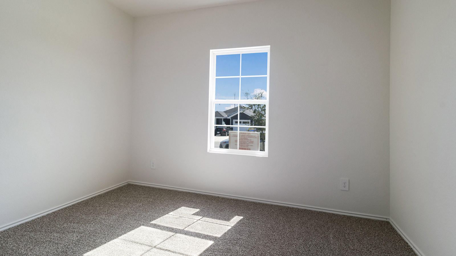 Bedroom 2 with carpeted flooring.