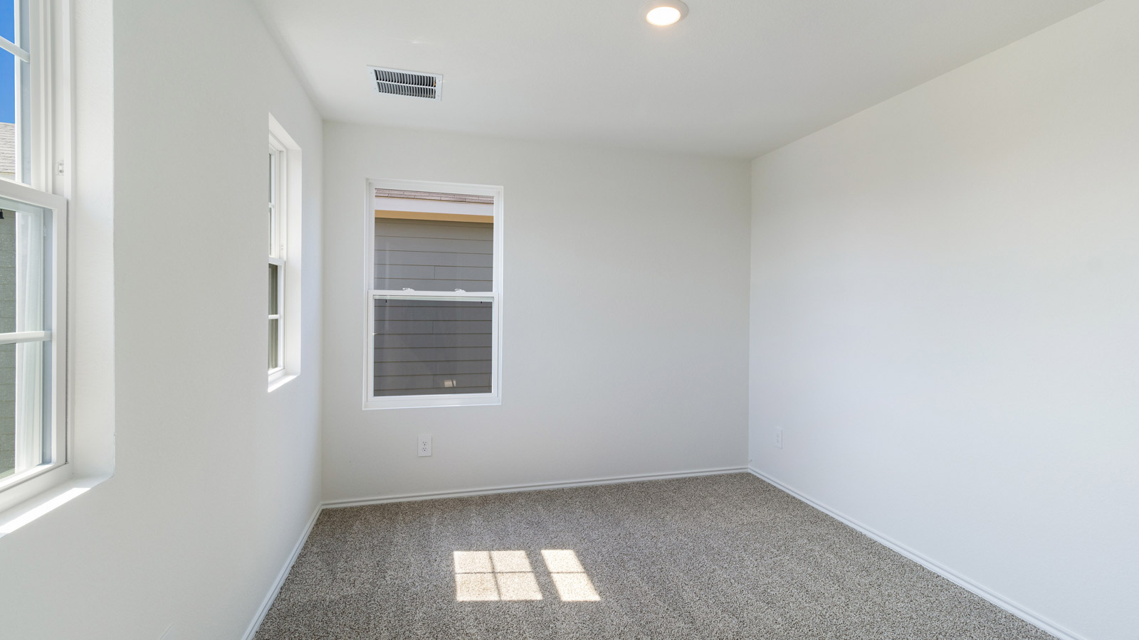 Bedroom 3 with carpeted flooring.