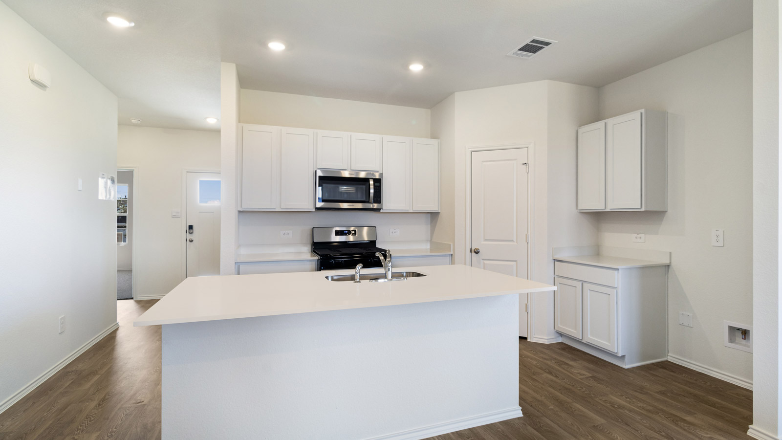 Kitchen with quartz countertops.