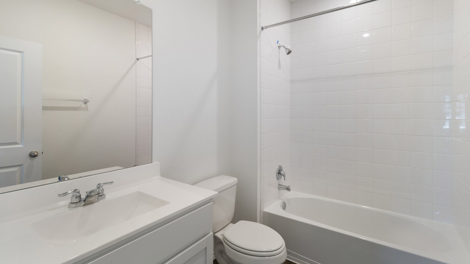 Family full bathroom with vanity, mirror, lighting, cabinets, and tub-shower combination