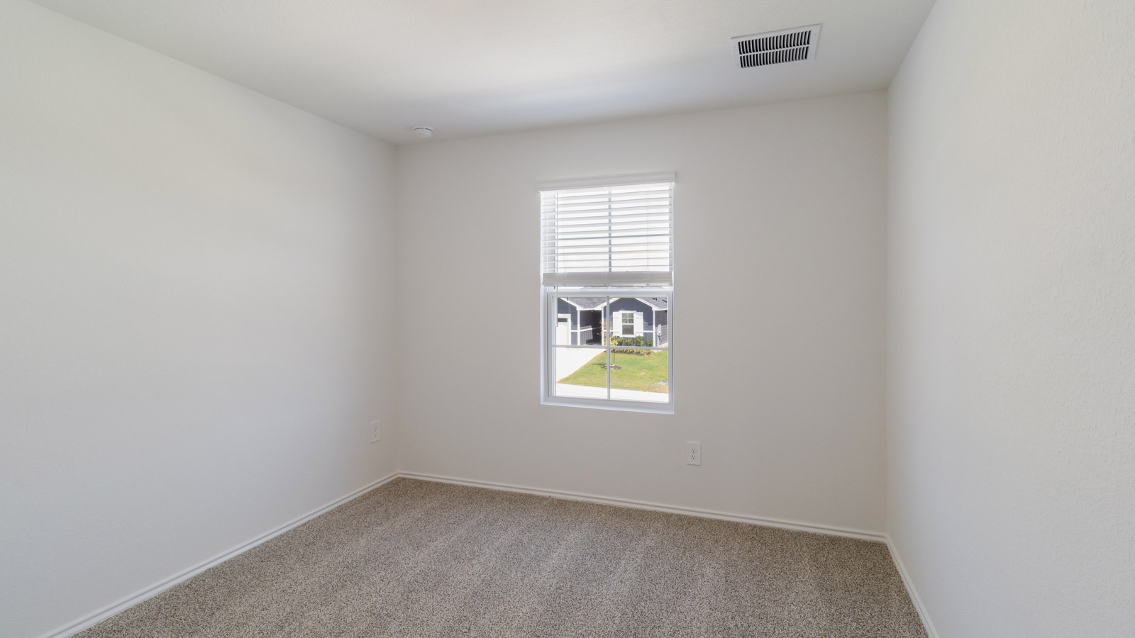 Additional angle of Bedroom 3 showing layout and window lighting
