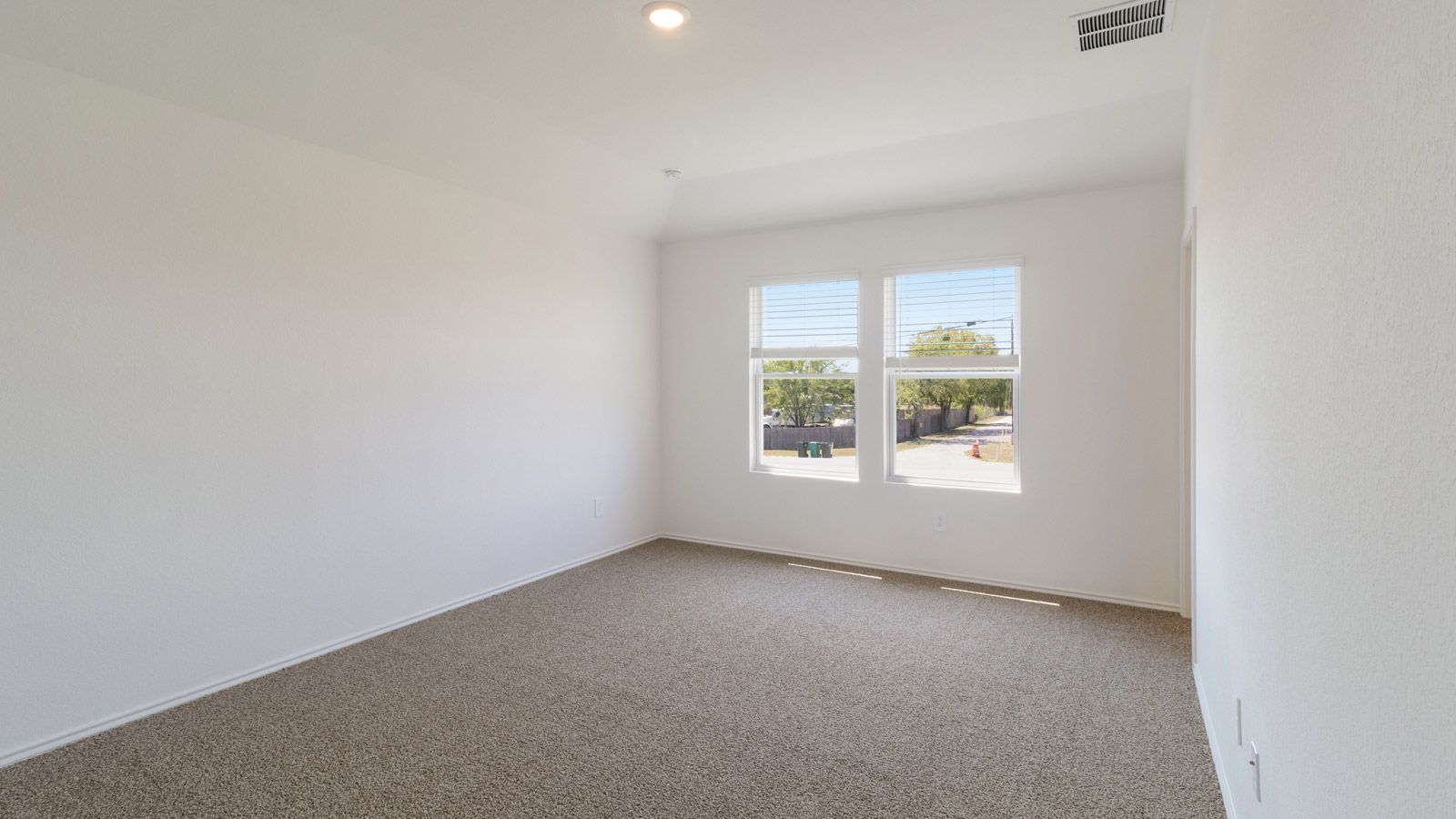 Primary bedroom designed with privacy and comfort in mind, flowing into the spa-inspired ensuite and walk-in closet