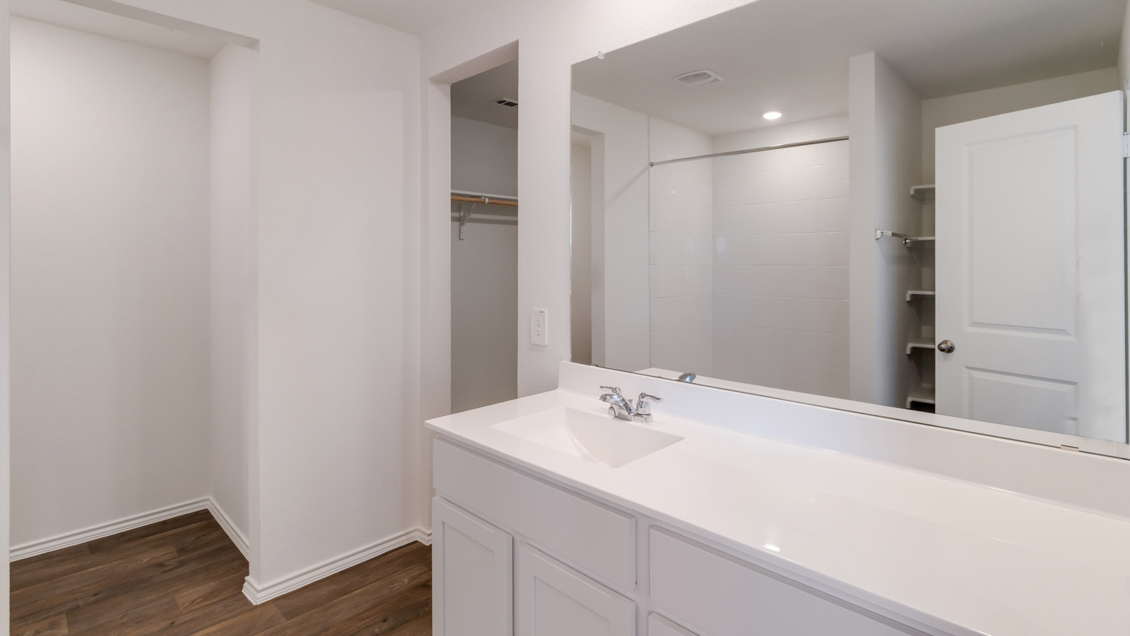 Owner’s ensuite featuring vanity space and direct access to the walk-in closet for storage efficiency Marigold by D.R. Horton