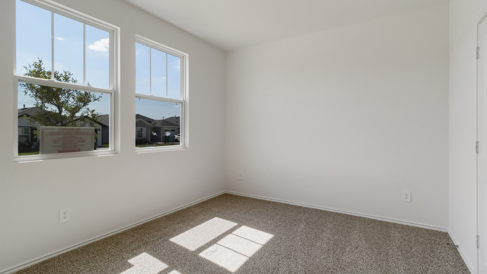 Bedroom 2 with closet storage and connection to shared upstairs spaces