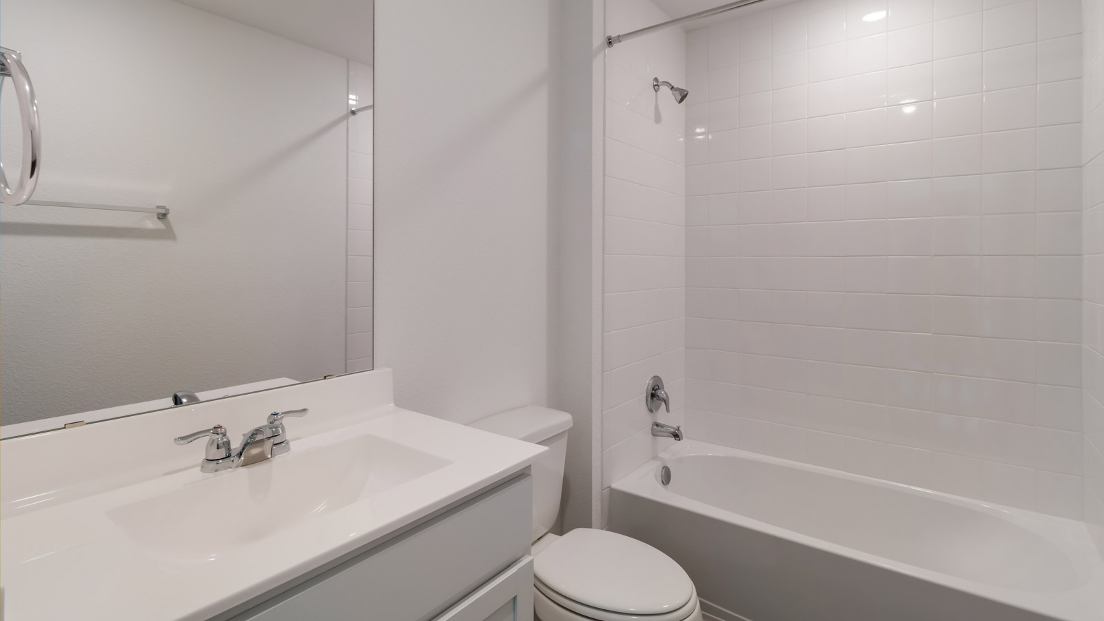 Second view of the shared full bathroom with polished finishes