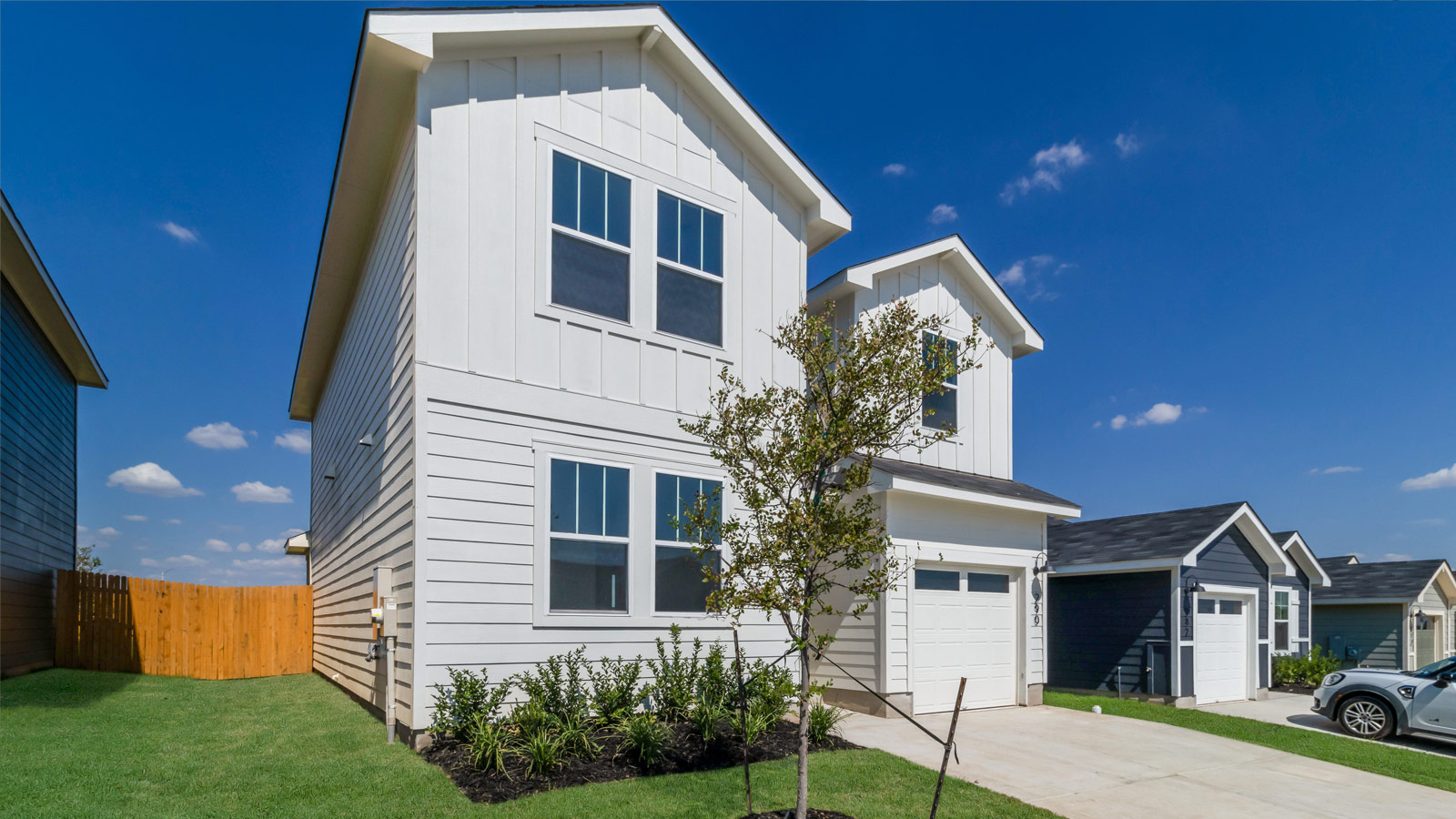 Left-side exterior angle highlighting entry, façade, and roofline