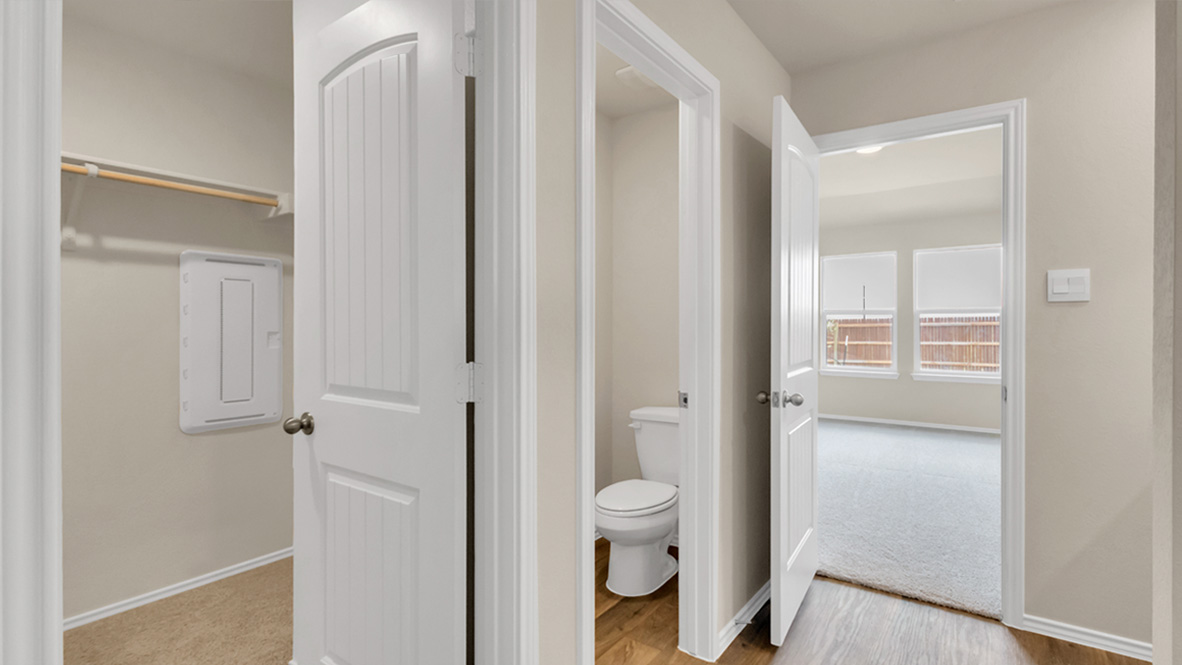 bathroom featuring dual vanity sinks, and built in shelves