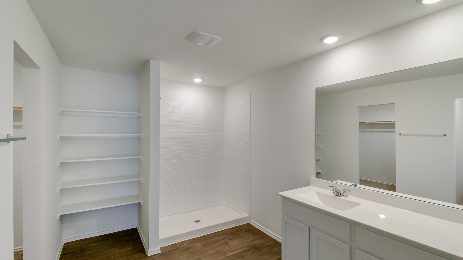 bathroom with vanity sink, and a walk in shower