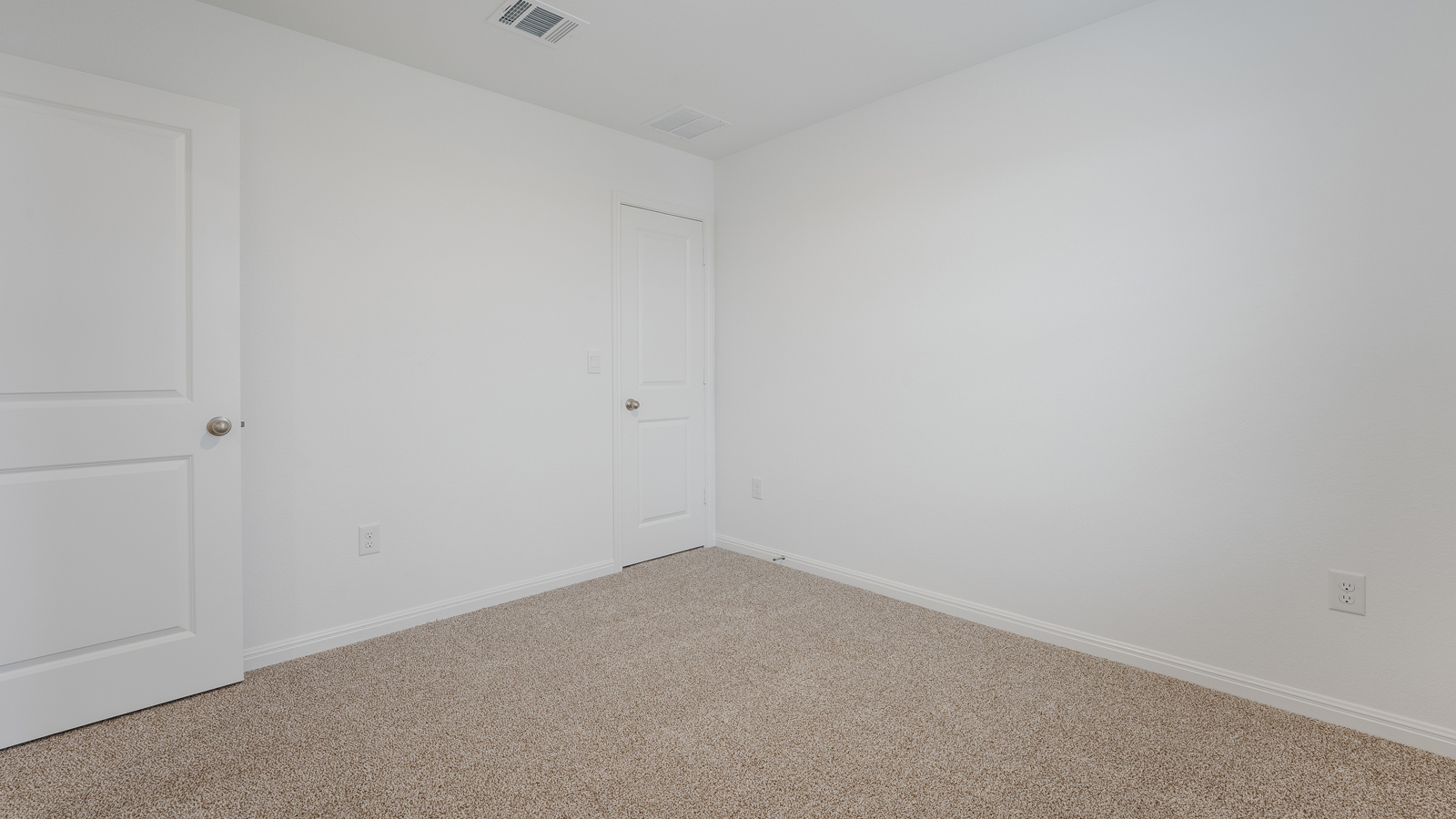 Bedroom 2 with carpeted floors and closet.