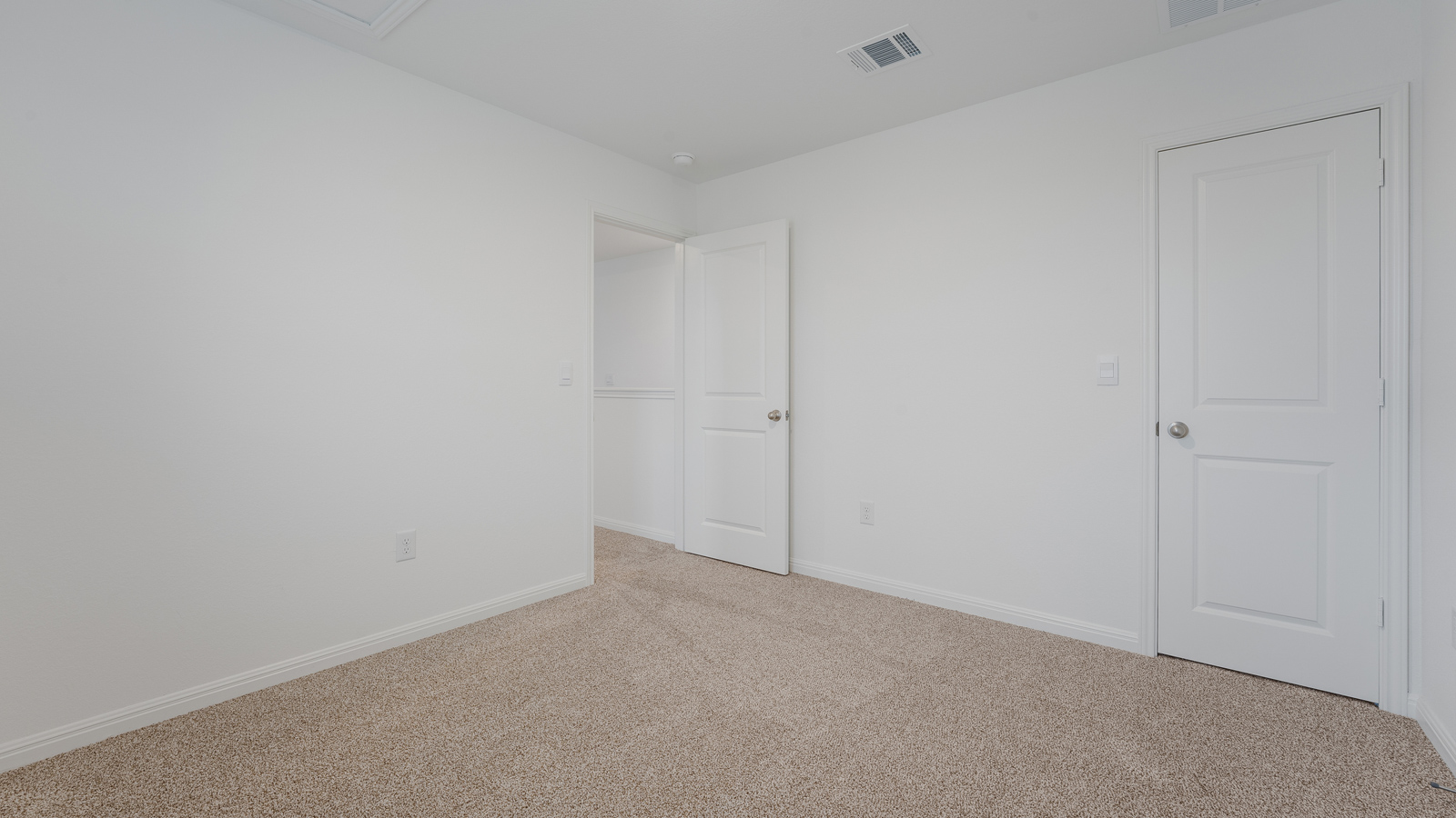 Bedroom 3 with carpeted floors and closet.