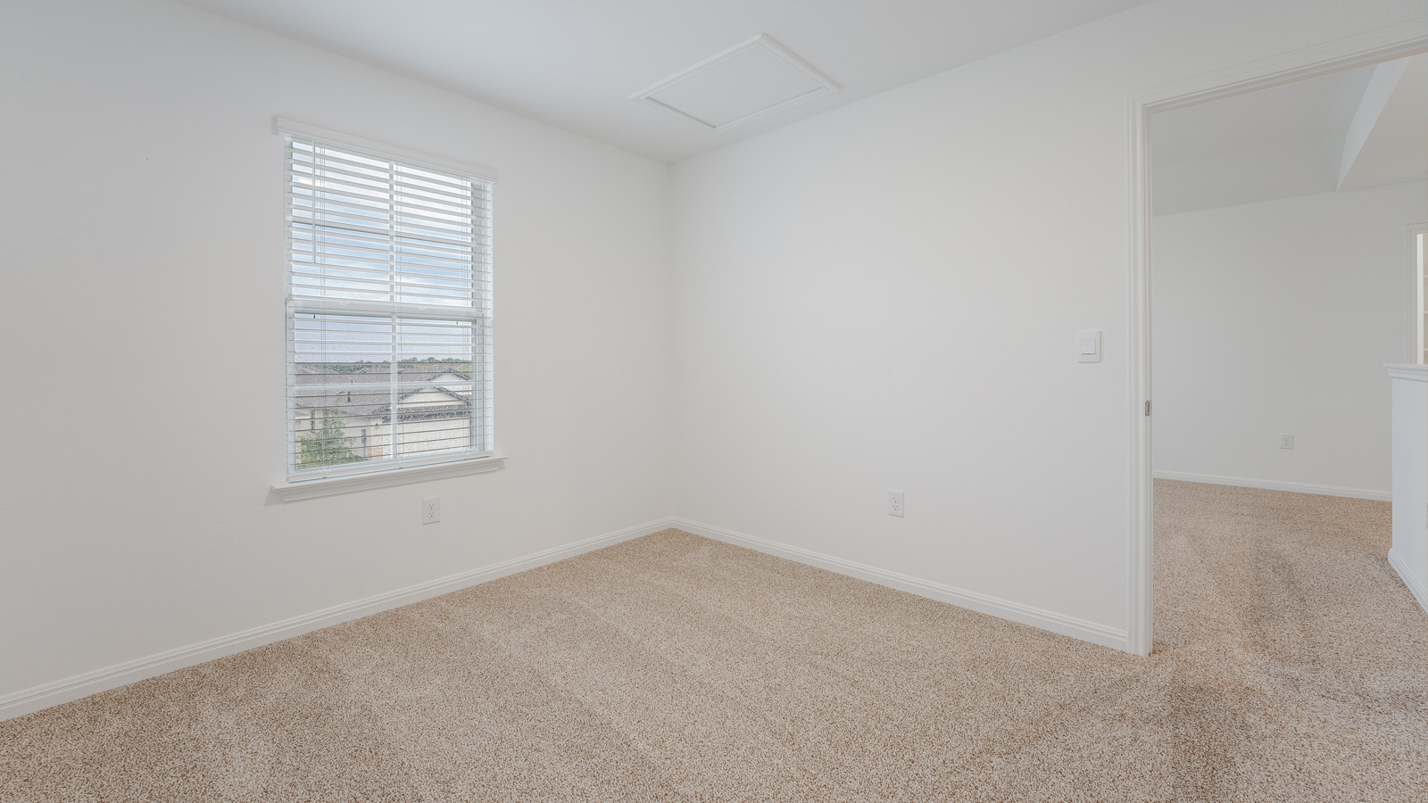 Bedroom 3 with carpeted floors and closet.