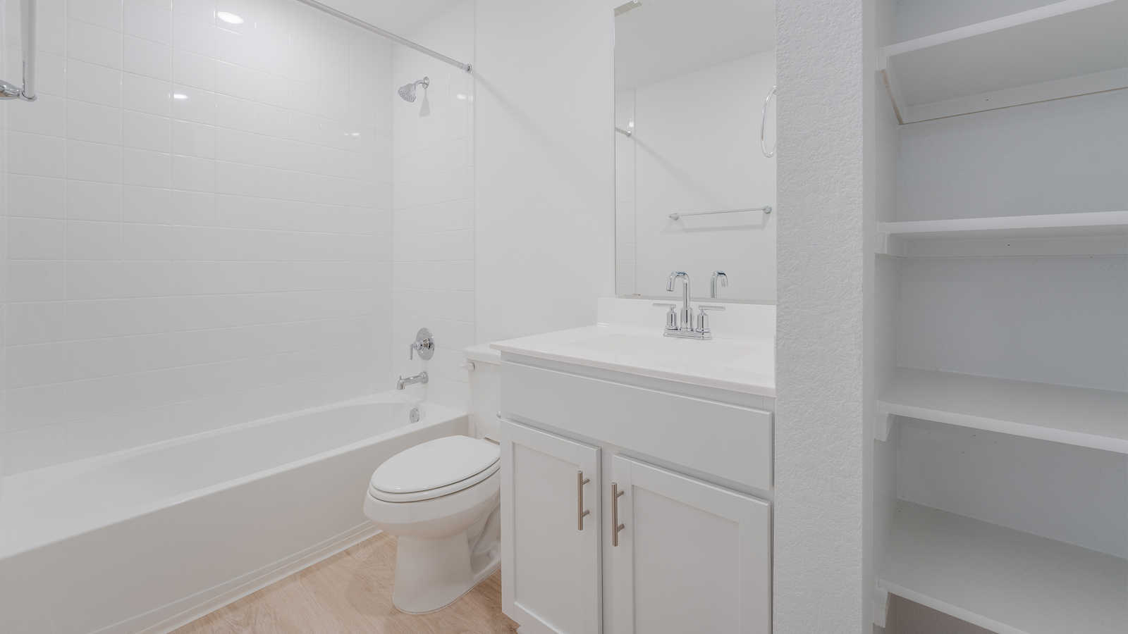 Bathroom 3 with single vanity sink, bathtub, and shower.