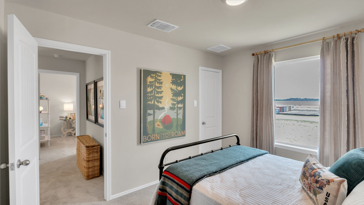 Upstiars bedroom 3 with carpeted floors.