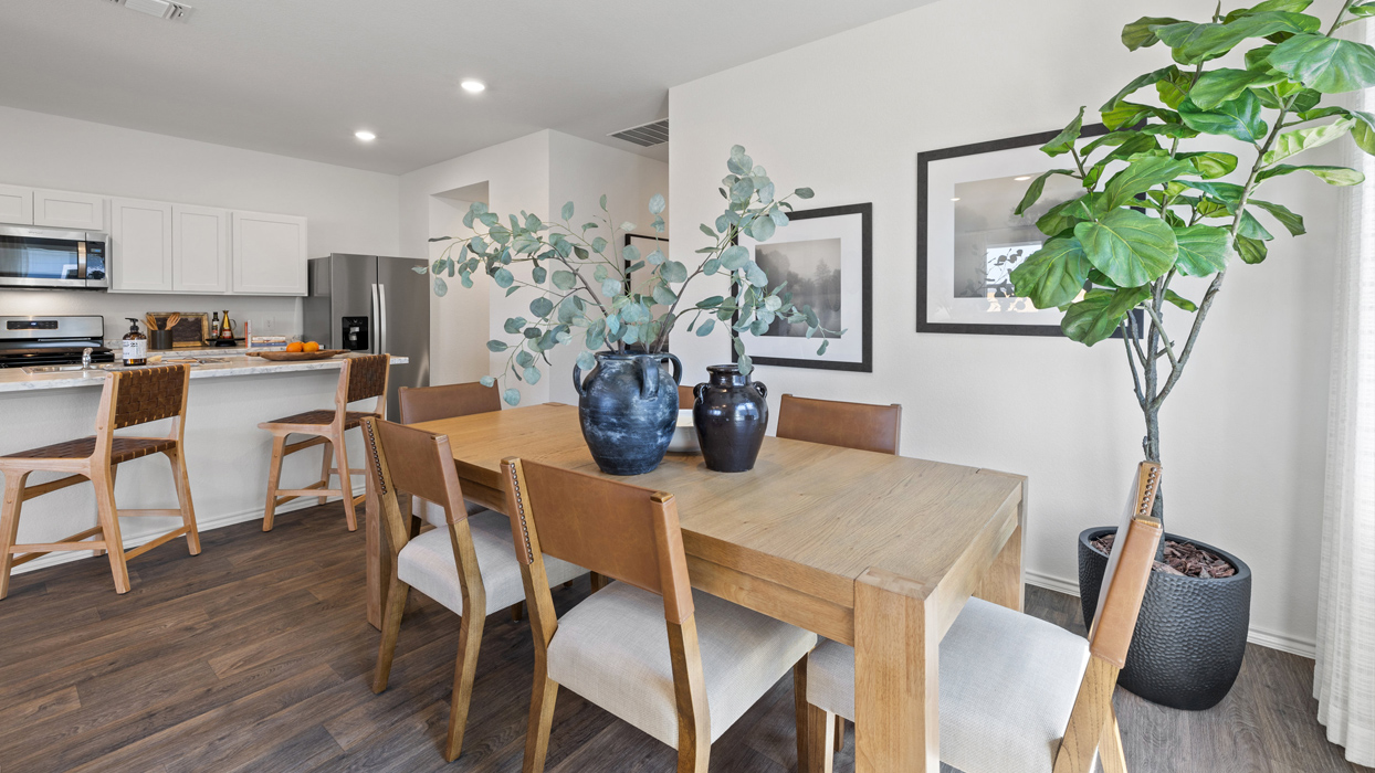 spacious kitchen with white cabinetry, large island and stainless steel appliances