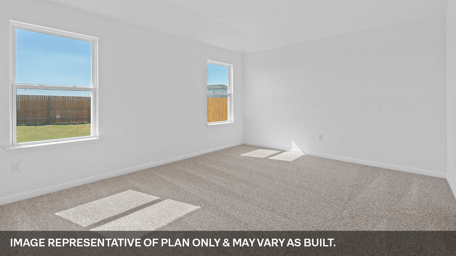 Primary bedroom with two windows.