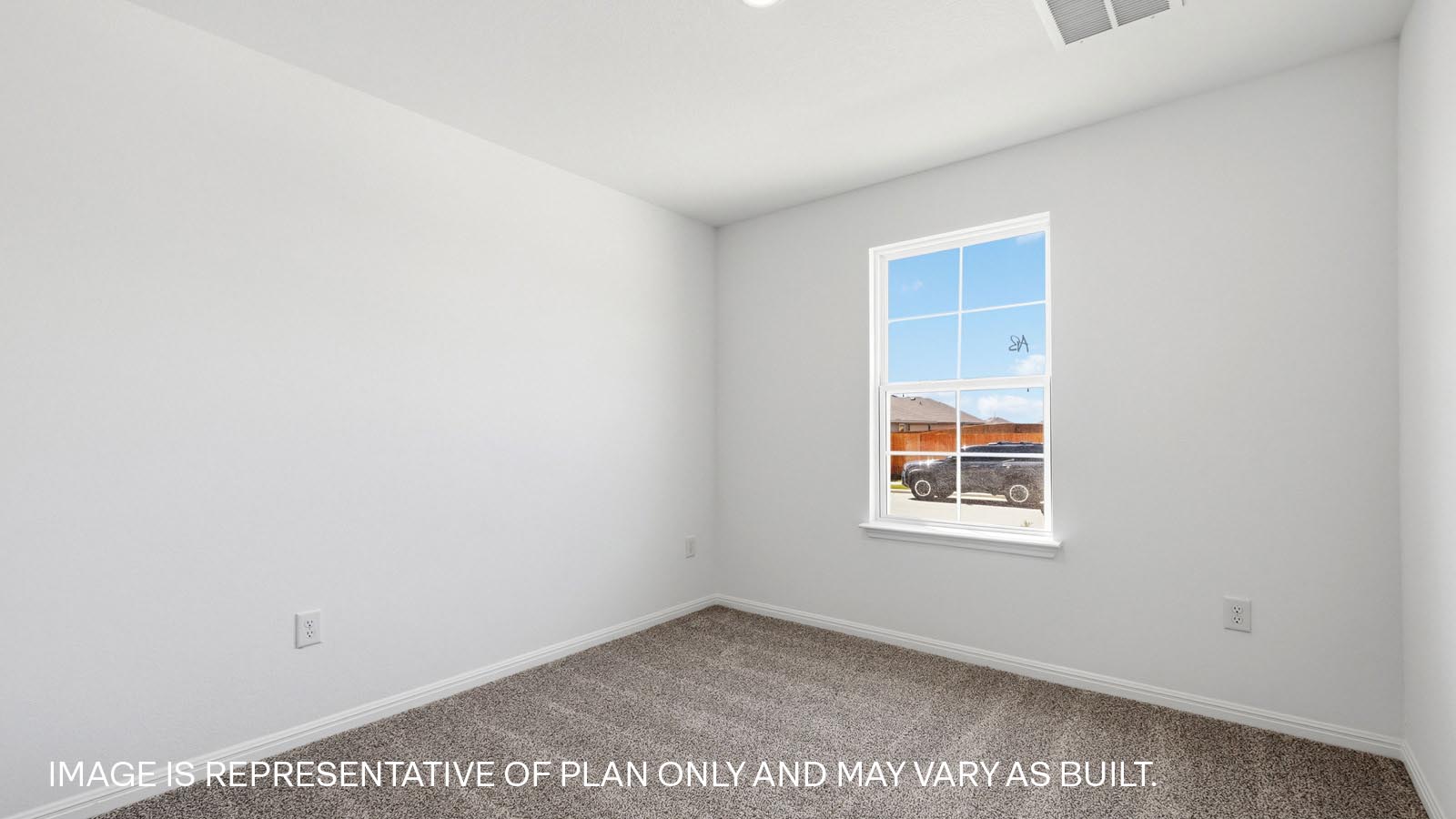 Bedroom 2 with carpeted flooring.