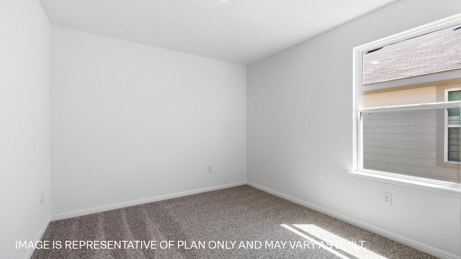 Bedroom 3 with carpeted flooring.