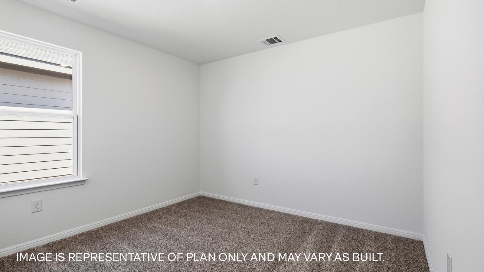 Bedroom 4 with carpeted flooring.