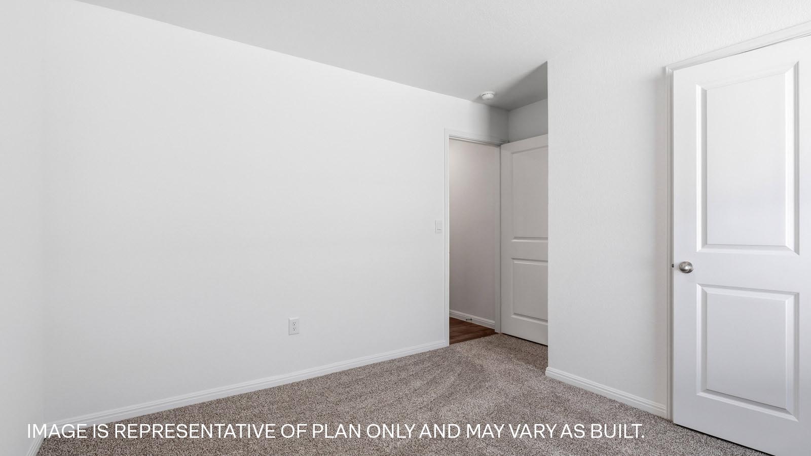 Bedroom 4 with carpeted flooring.