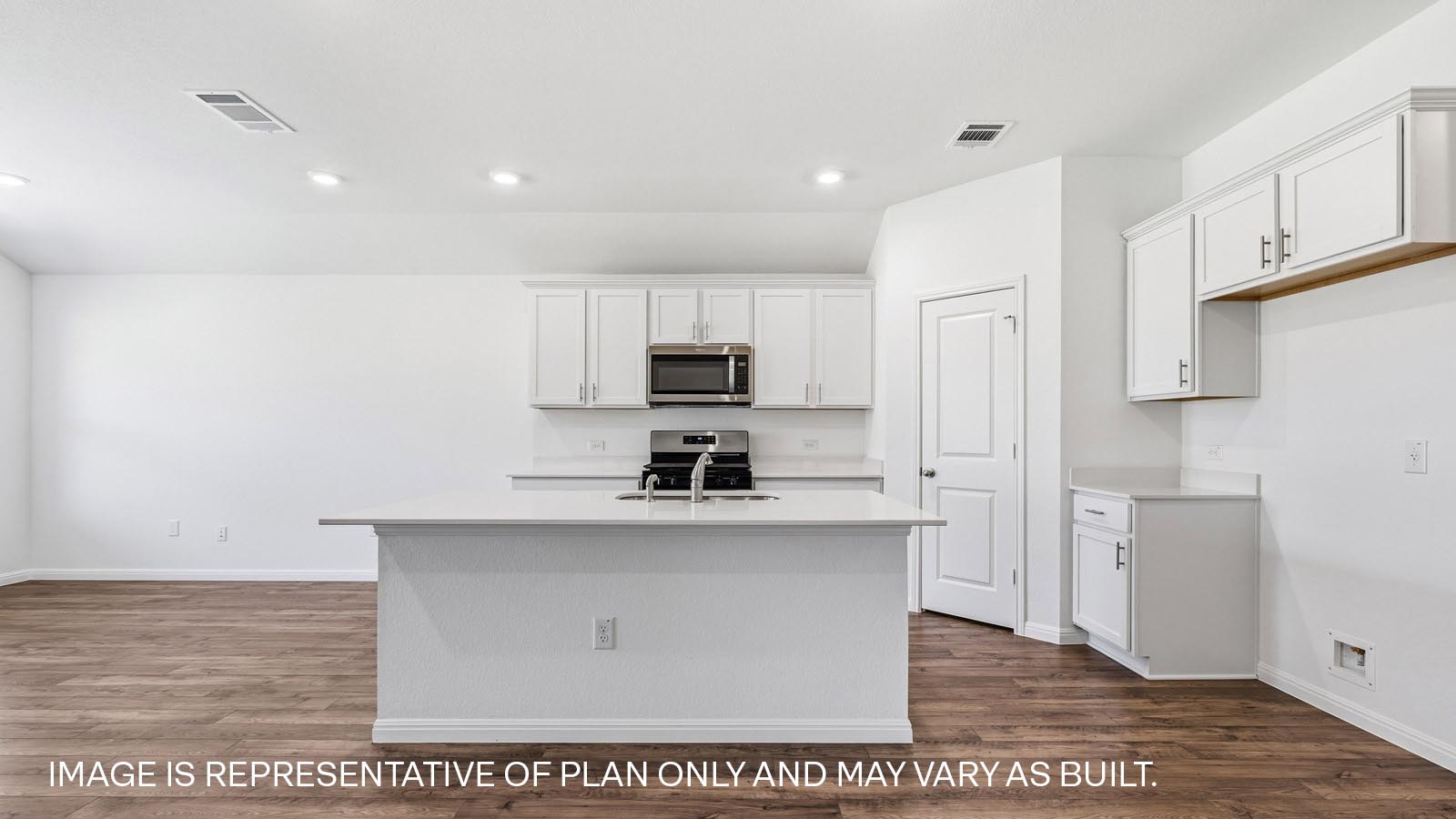 Modern kitchen with quartz countertops.